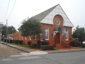 Southern Synagogue: Congregation Gates of Prayer New Iberia Louisiana. One story, narrow brick buildling with white facade.