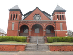 Southern Synagogues: Temple Mishkan Israel Selma, Alabama. Symmetrical brick building with front steps from street.