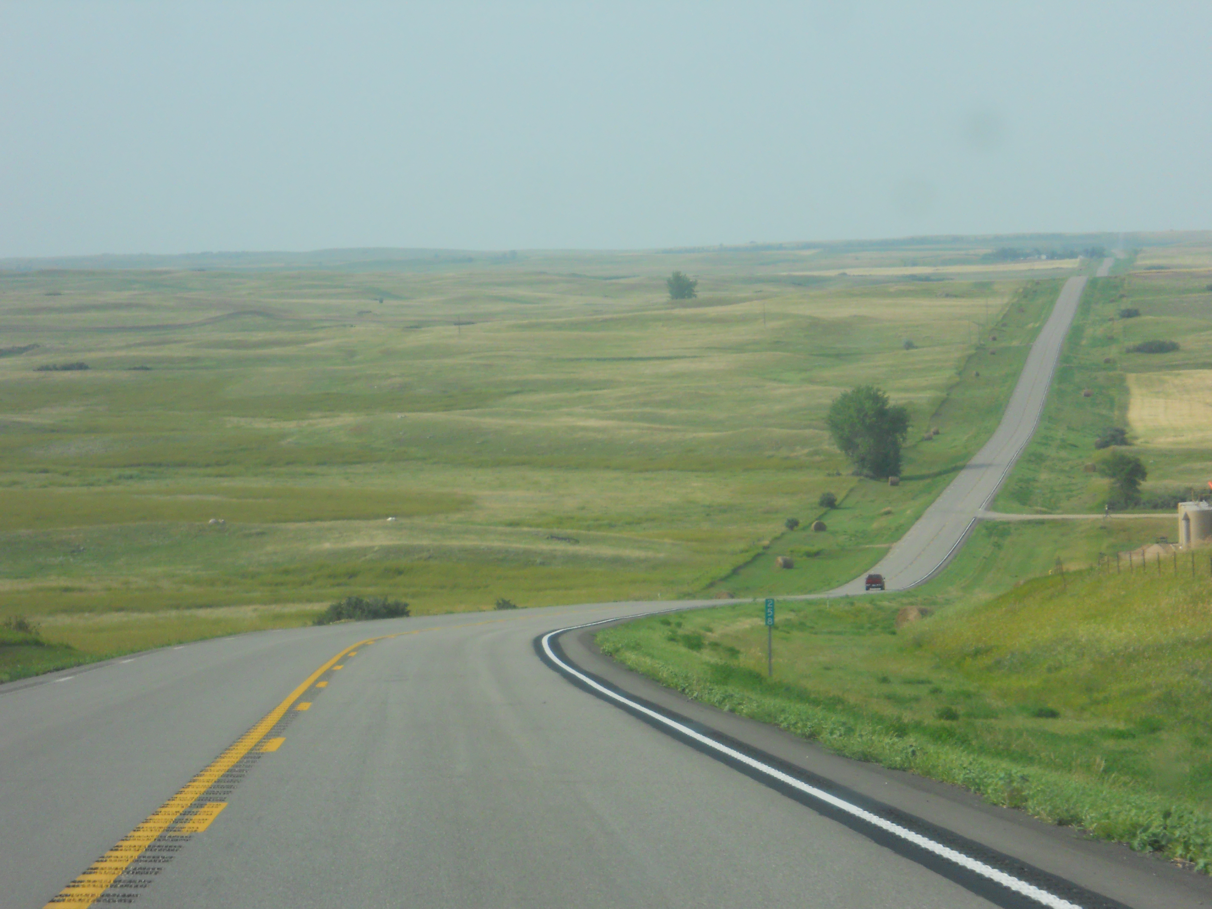 long, winding roadway that disappears into the distance